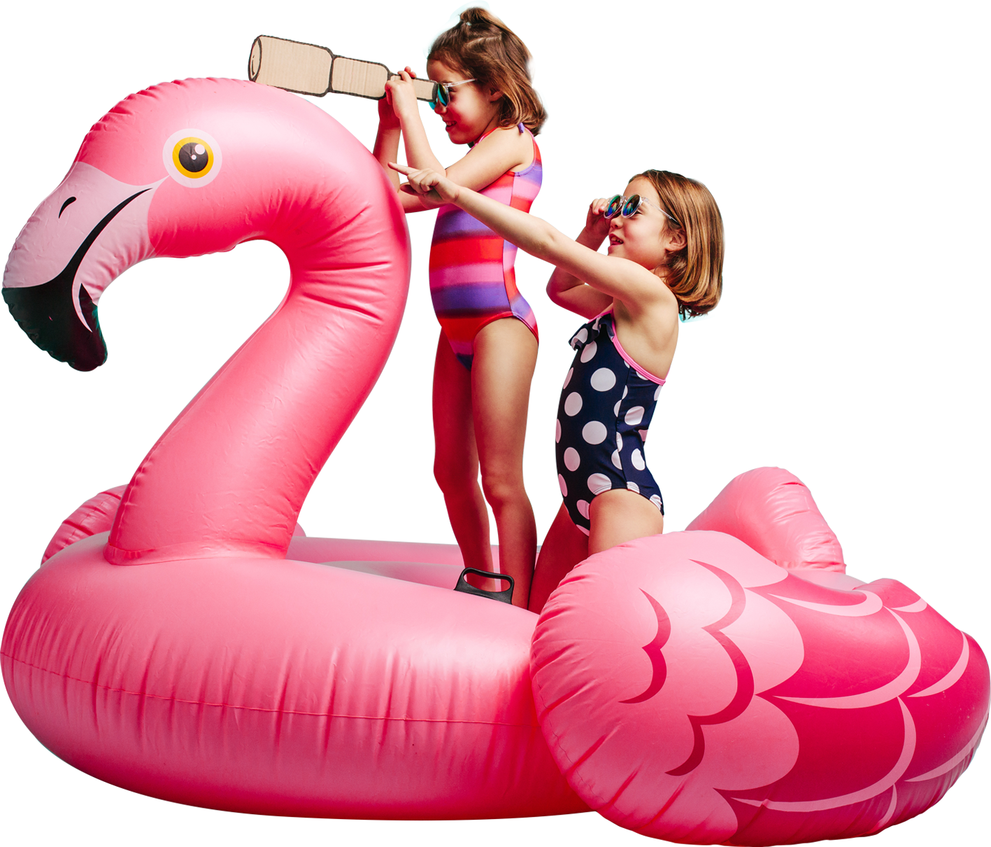 deux fillettes sur une bouée flamant rose jouant aux exploratrices